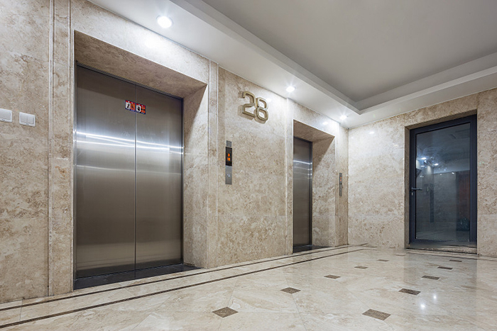 Why Do We Repeatedly Press The Elevator Button? - Newsweek